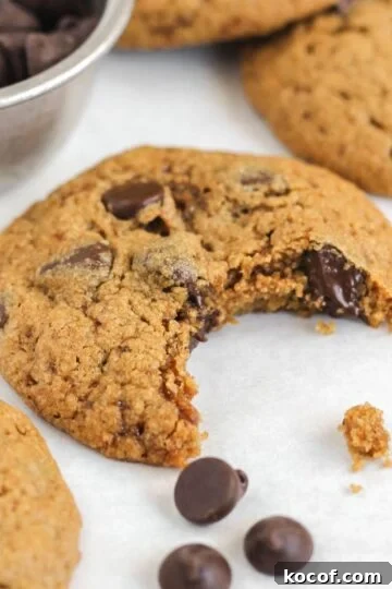 Oat flour chocolate chip cookie with a bite taken out.