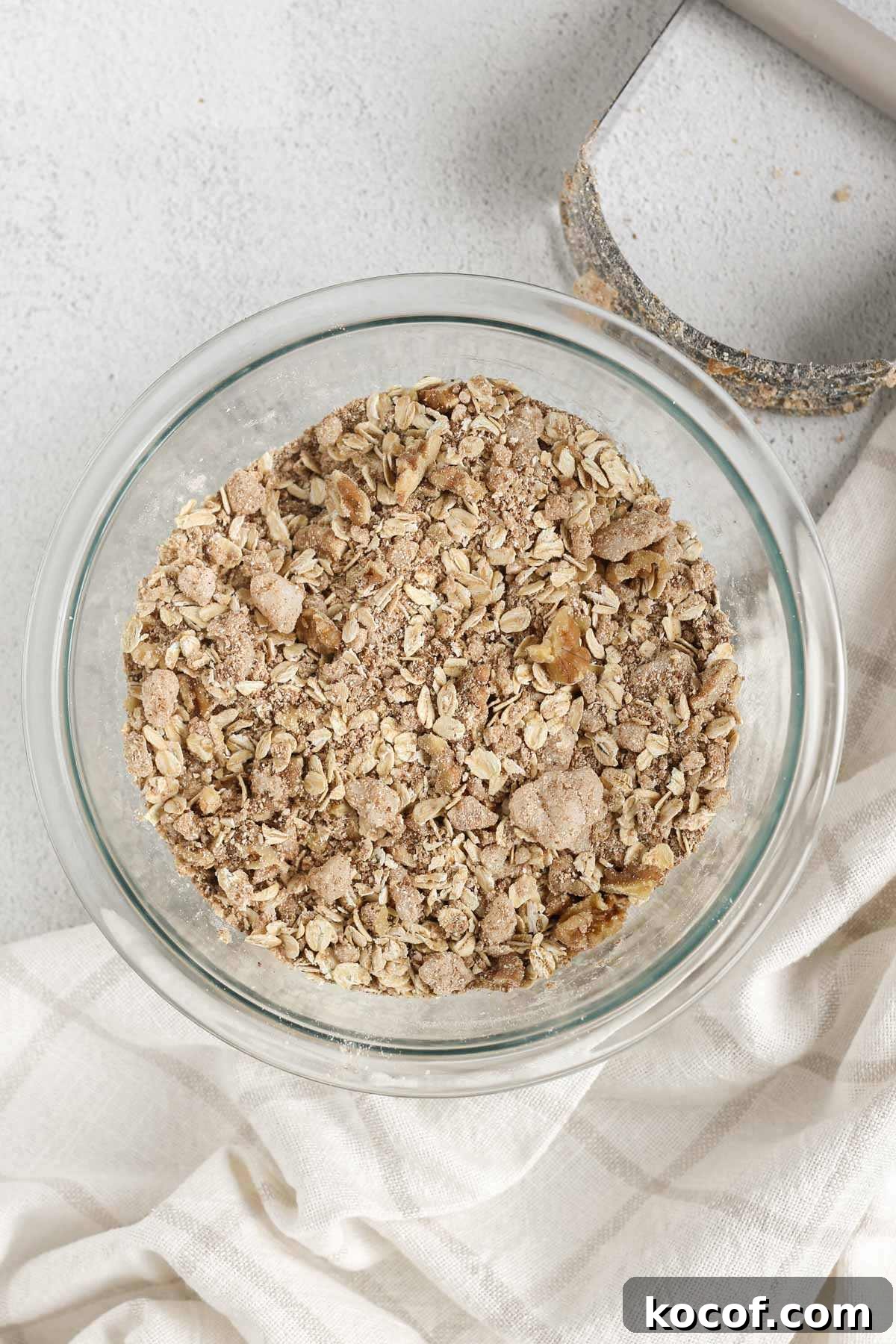 Apple crisp topping in a glass mixing bowl.