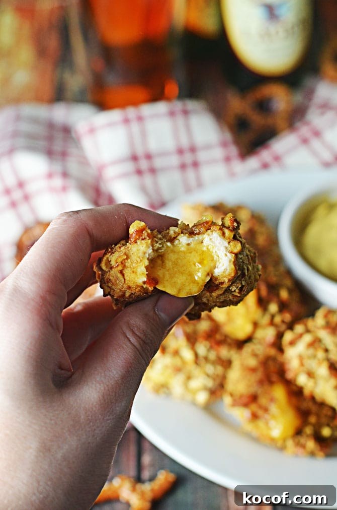 Pretzel-Crusted Chicken Nuggets Stuffed with Beer Cheese Dip 4 Pretzel-Crusted Chicken Nuggets Stuffed with Beer Cheese. These make the perfect Super Bowl appetizer or party treat. Grown-up chicken nuggets that make your taste buds smile. | hostthetoast.com