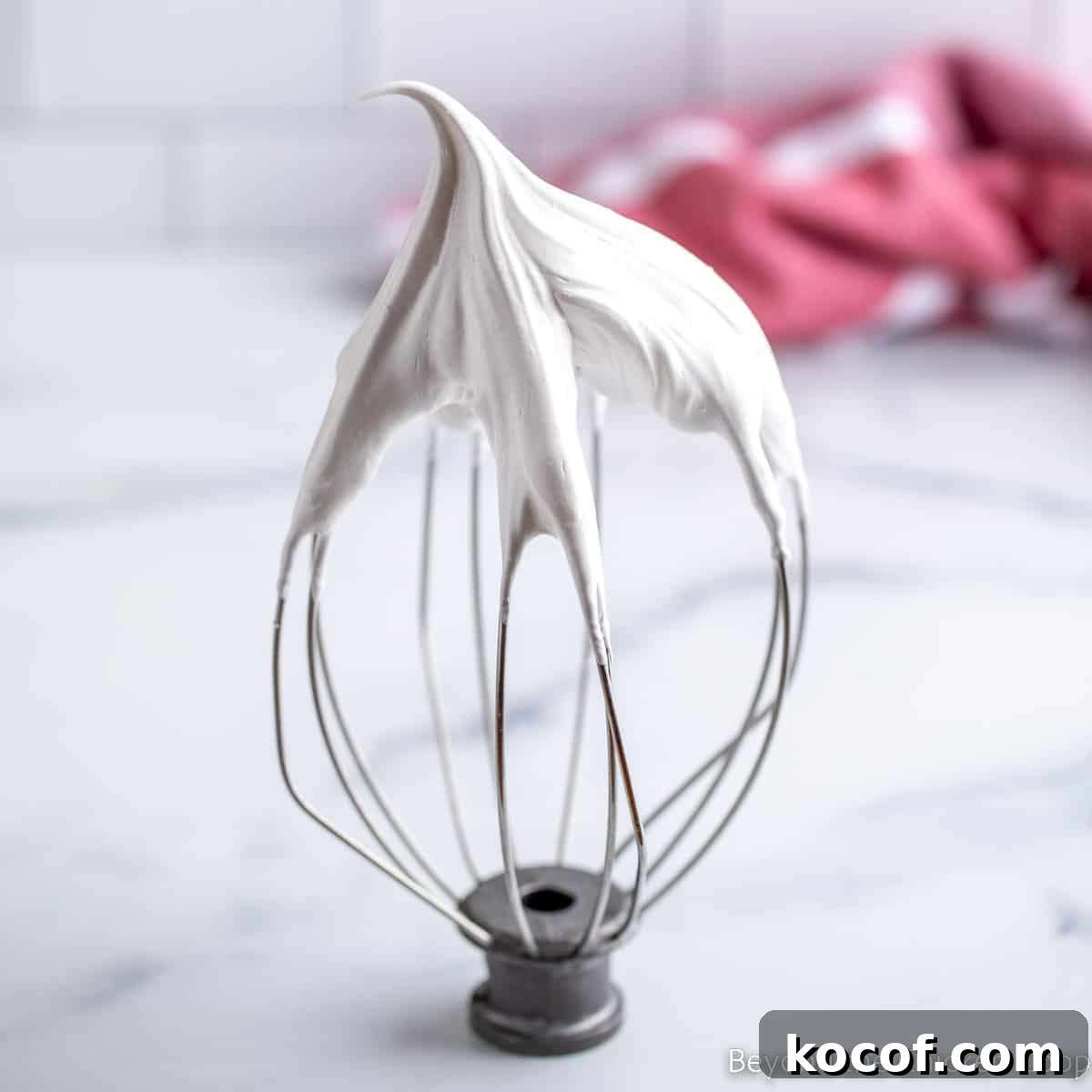 Meringue on a whisk.