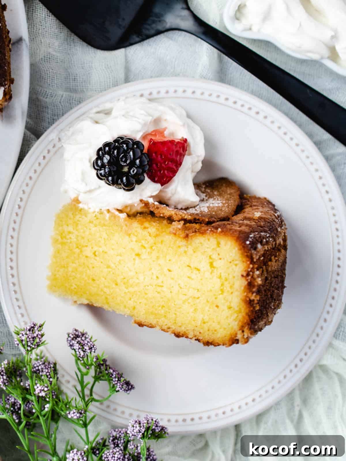 Top your olive oil cake with lemon and berries.