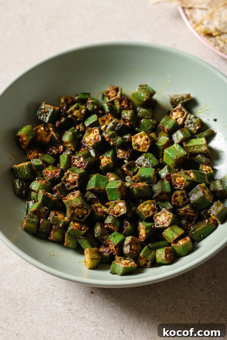 Bhindi Fry in a light blue bowl.