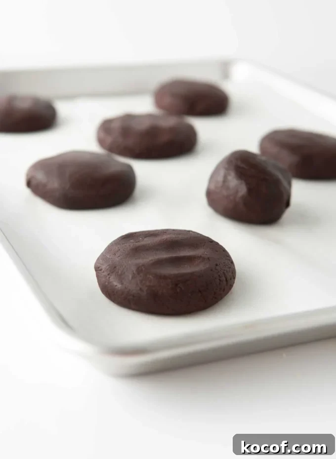 Fudgy Peppermint Brownie Cookie Recipe 7 cookie dough balls slightly flattened on tray