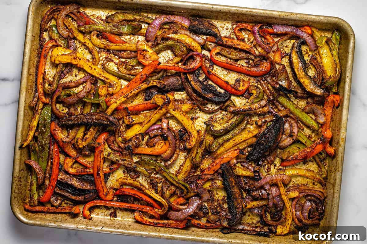 Baking sheet filled with oven baked fajita veggies