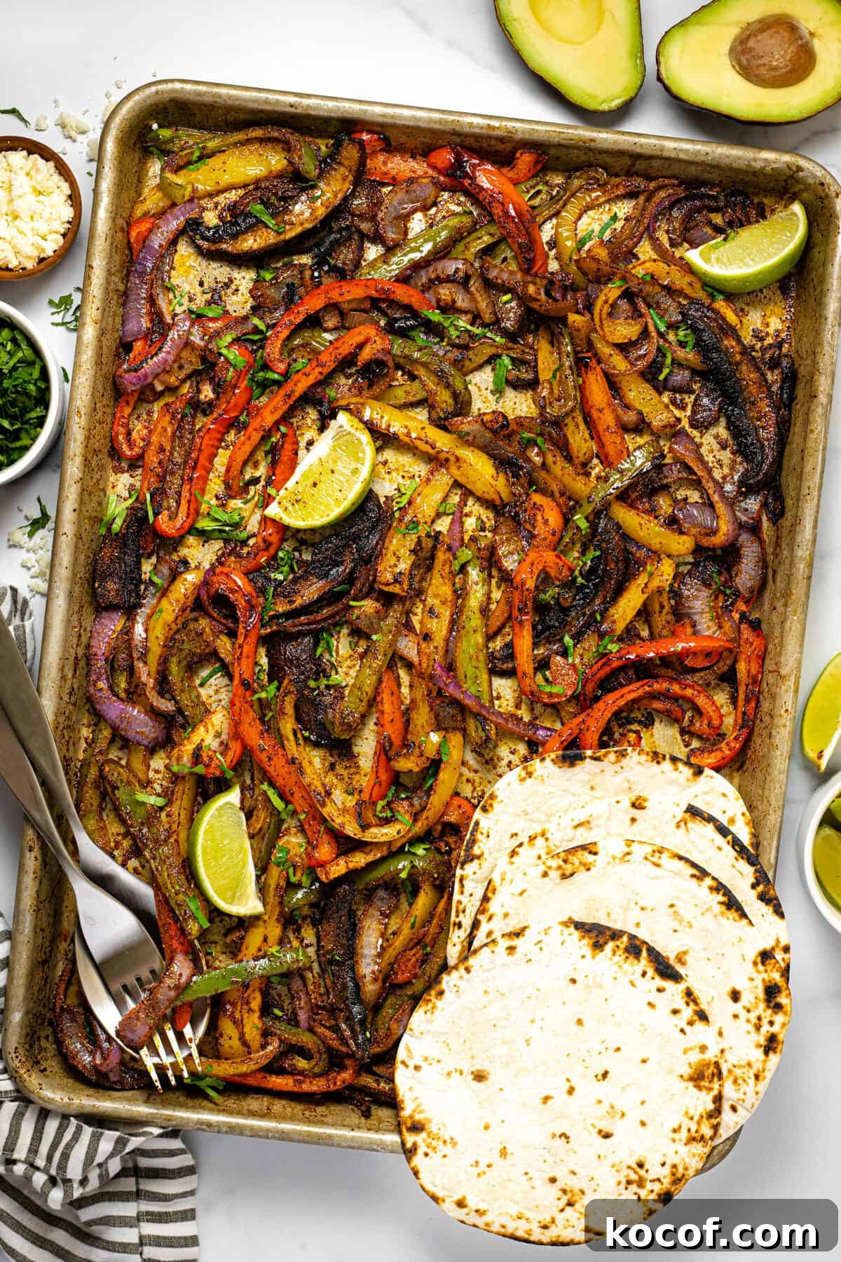 Baking sheet filled with oven baked fajita veggies