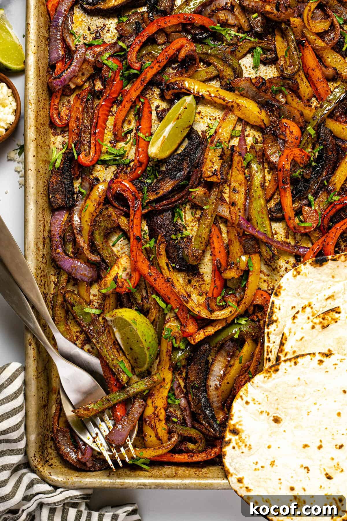Baking sheet filled with oven baked fajita veggies