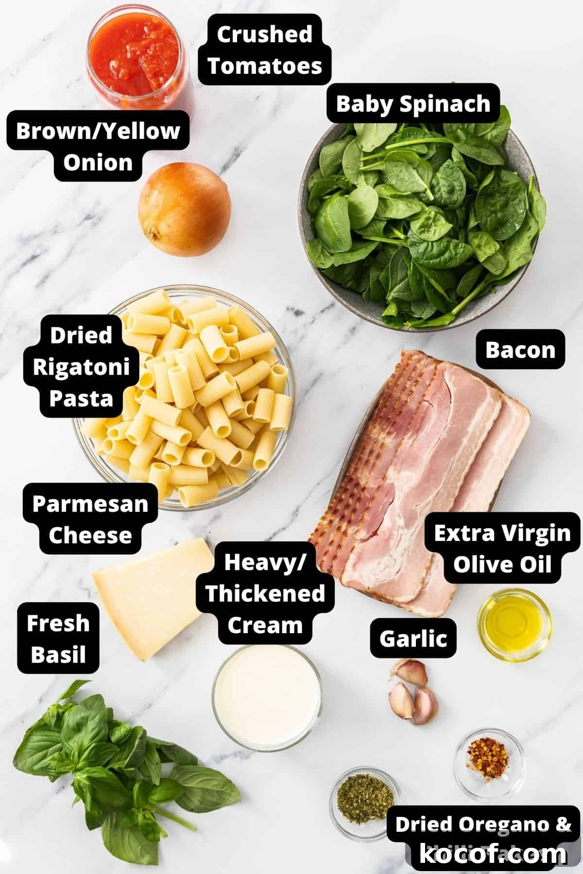 Creamy Bacon & Tomato Pasta Recipe for Busy Weeknights 4 Ingredients in this recipe on a white marble background.