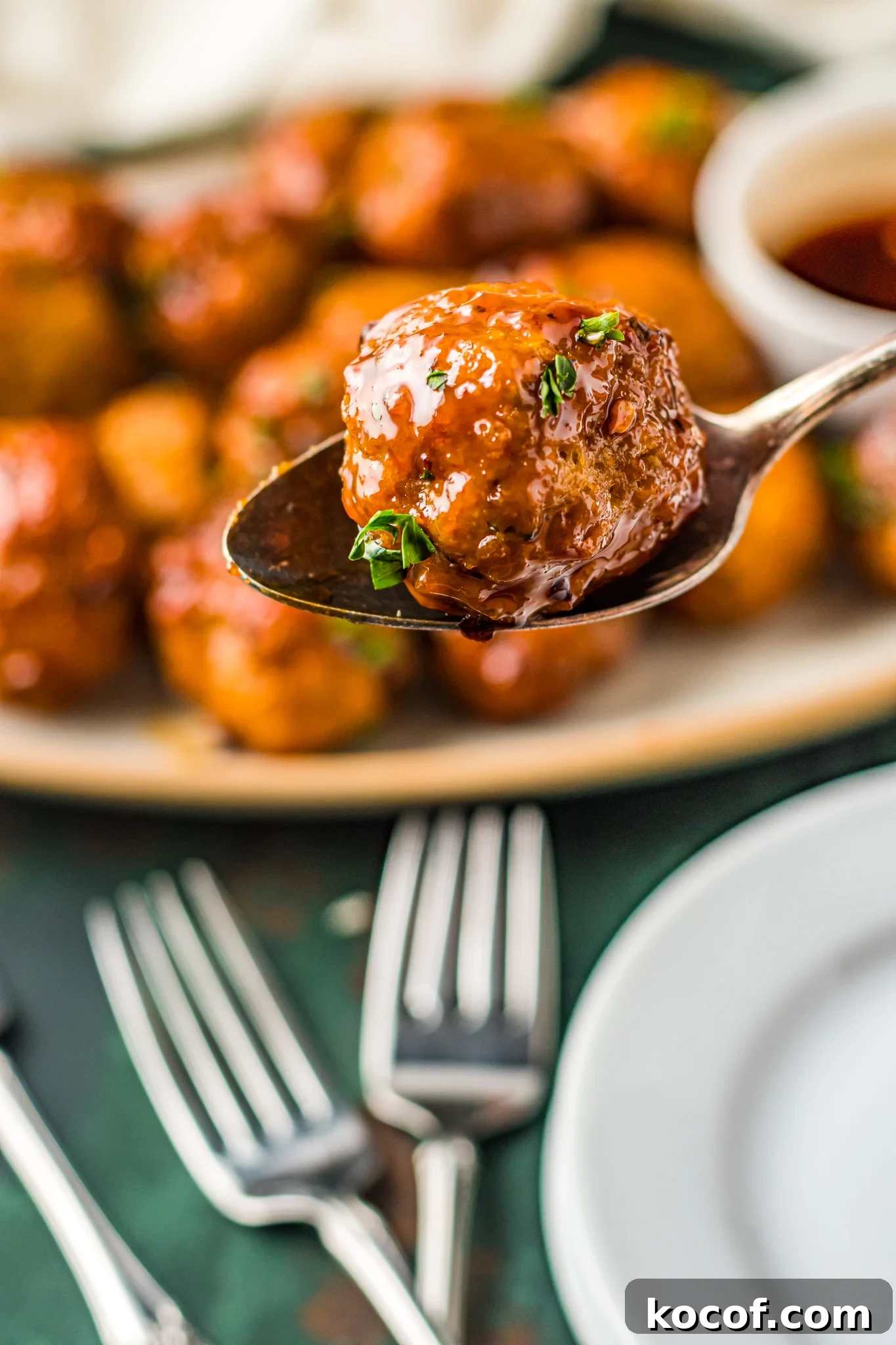 Crispy Air Fryer Meatballs Recipe for Quick Weeknight Meals 4 Air Fryer Meatballs on a spoon.