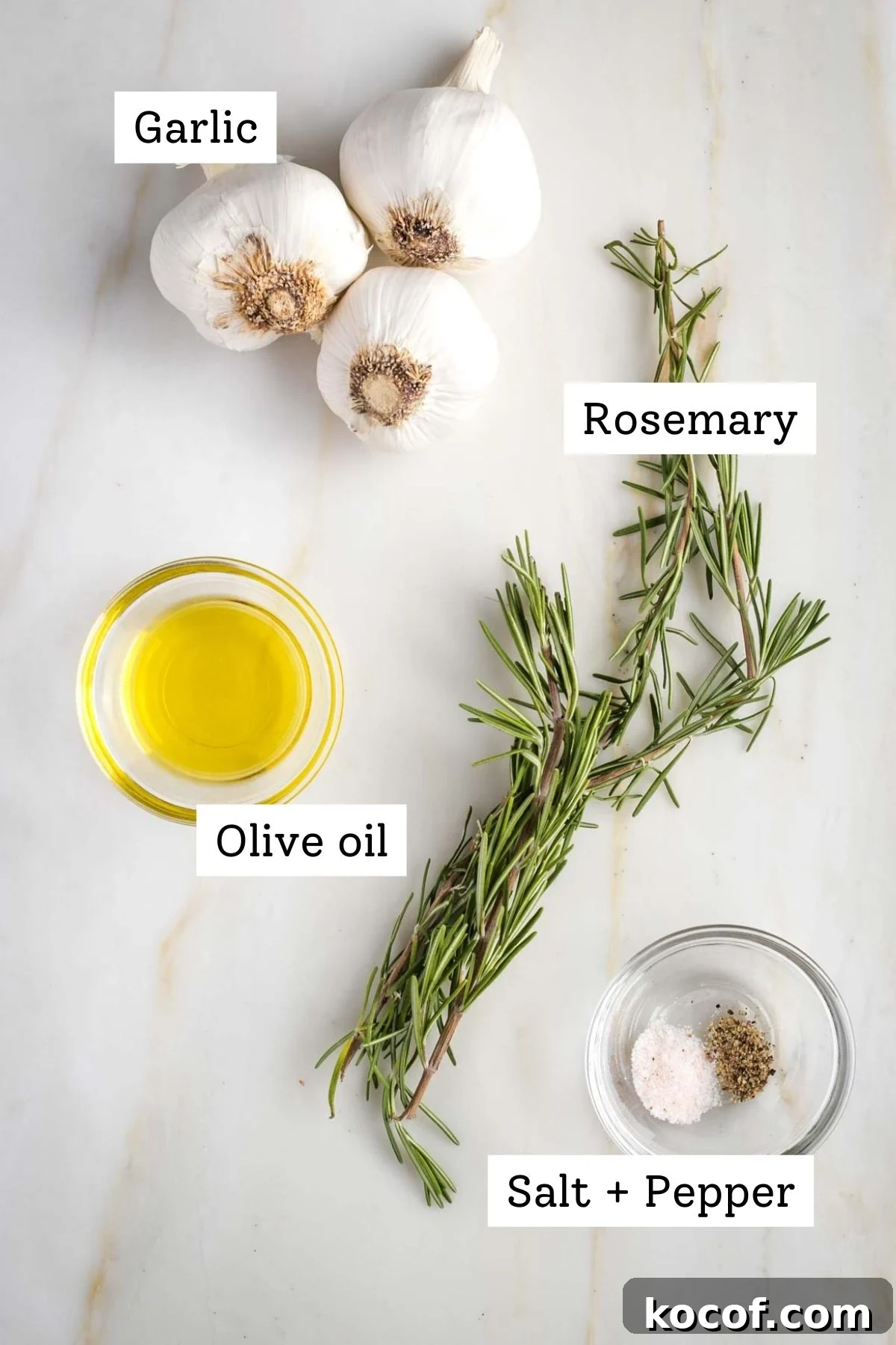 Oven-Roasted Garlic Bulbs: Crispy, Sweet Garlic Recipe 3 Labeled ingredients: garlic, rosemary, olive oil, salt and pepper.