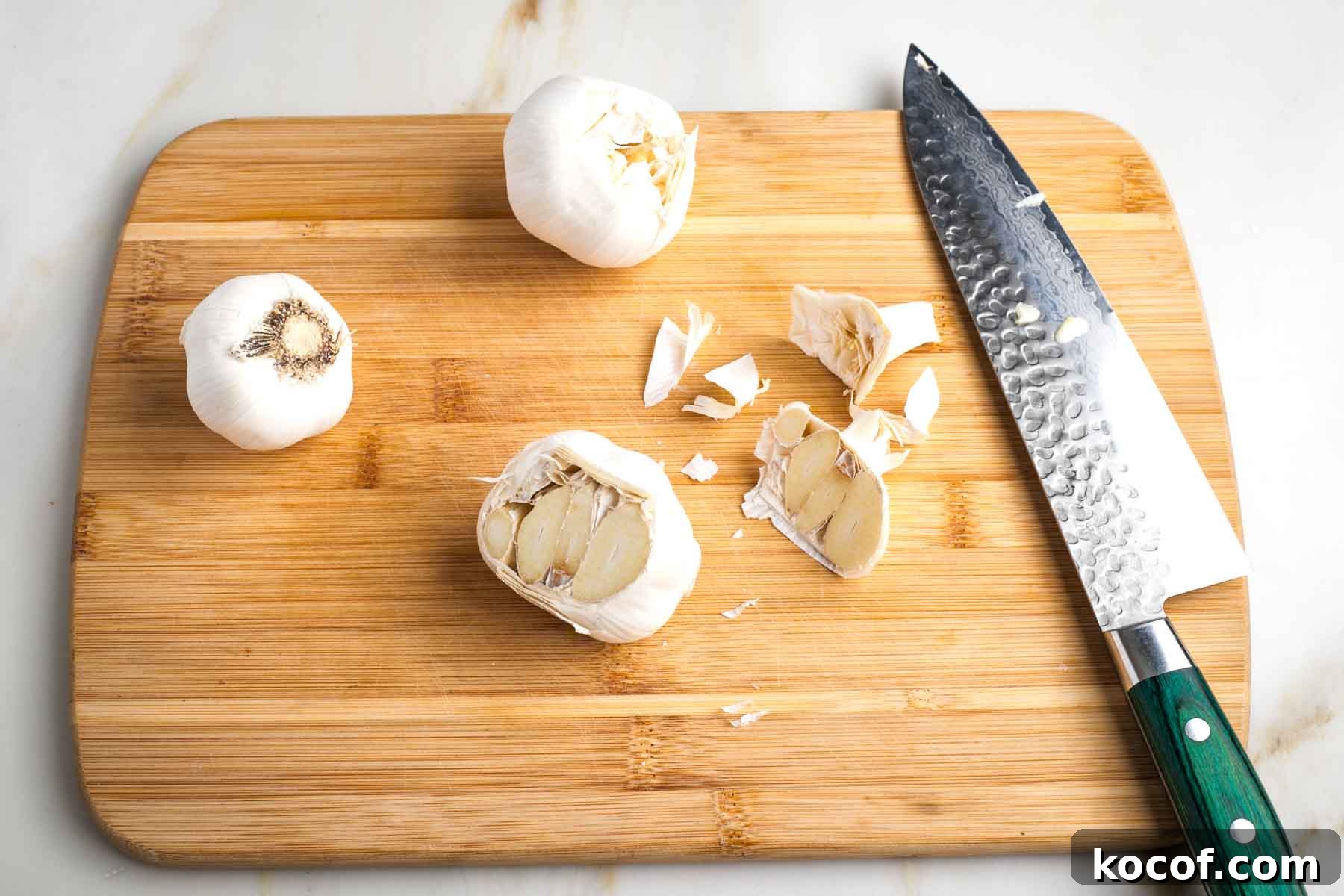 Oven-Roasted Garlic Bulbs: Crispy, Sweet Garlic Recipe 4 Whole head of garlic trimmed, exposing flesh of cloves.