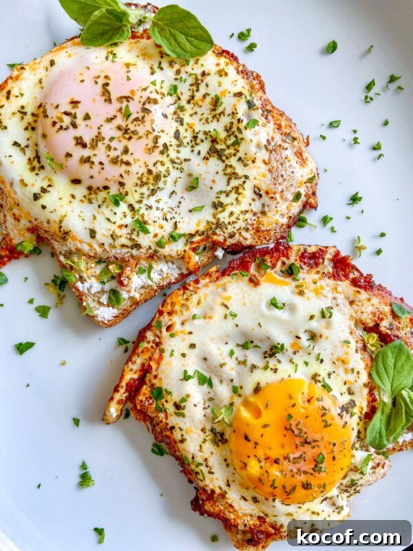 Perfect Hard-Boiled Eggs in the Air Fryer: Quick Guide 9 Two sunny-side-up eggs sprinkled with herbs and garnished with fresh green basil leaves on a white plate.