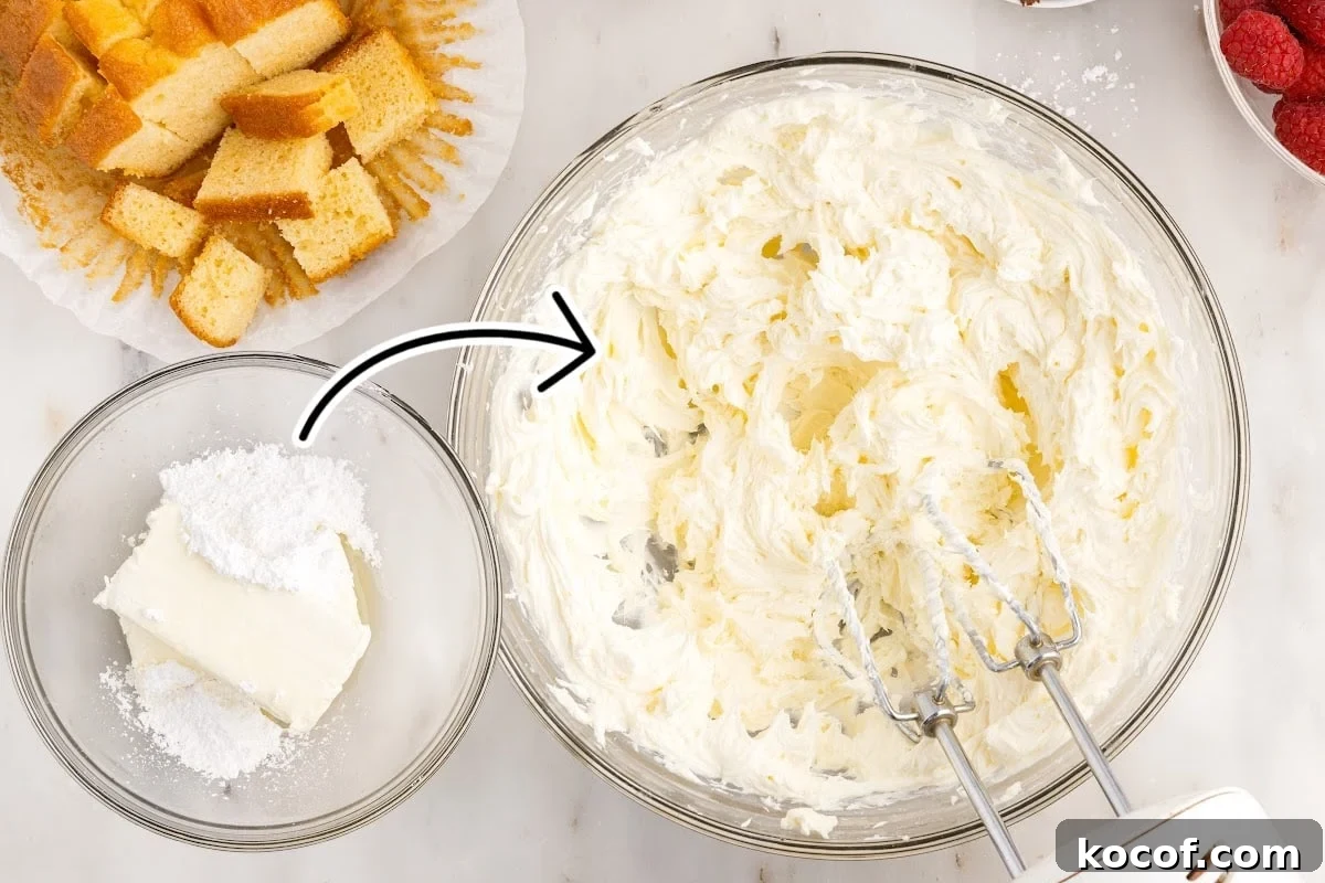 Decadent Raspberry Trifle Recipe with Layers of Cream and Cake 4 Cream cheese and powdered sugar in a bowl and a second bowl of cream cheese mixture with hand mixer inserted next to angel food cake.