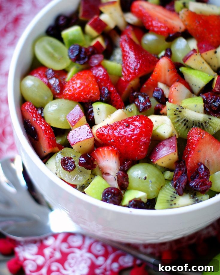 Red & green Fruit salad in a white bowl
