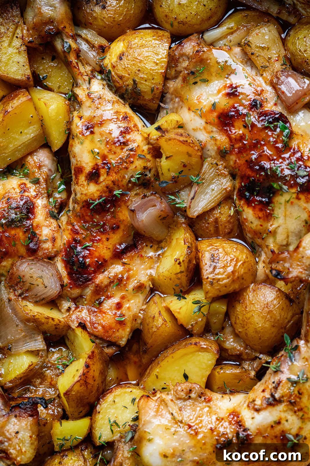 Honey Mustard One-Pan Chicken and Roasted Potatoes 3 extreme close up on a pan of oven roasted chicken and potatoes