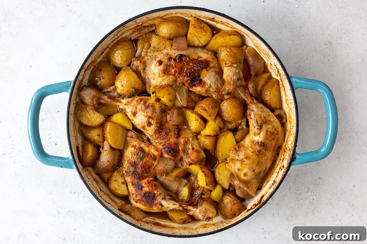 Honey Mustard One-Pan Chicken and Roasted Potatoes 9 shallow cast iron casserole dish with chicken leg quarters cooked with potatoes