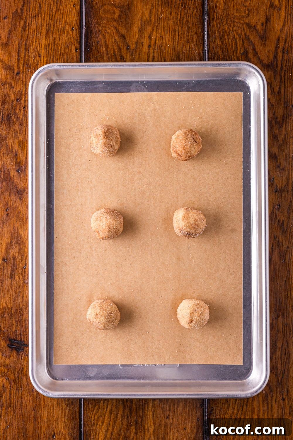 cookie balls for Biscoff Snickerdoodle Cookies on a baking sheet pan 
