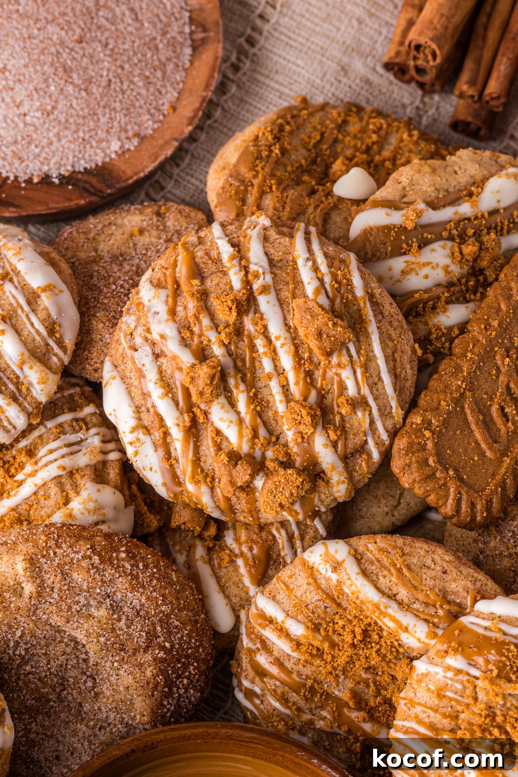 Biscoff Snickerdoodle Cookies spread around the table  with cookies 