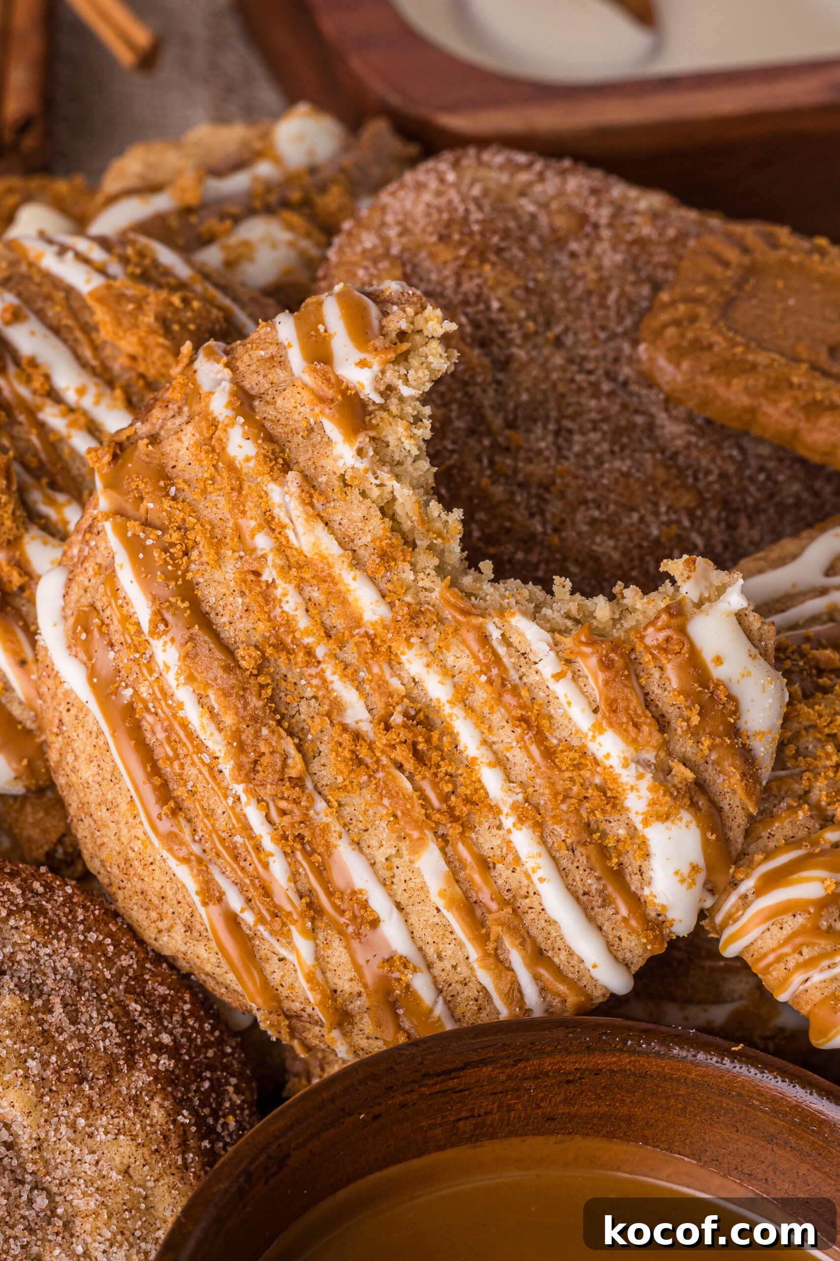 Biscoff Snickerdoodle Cookie with a bite missing out of it 