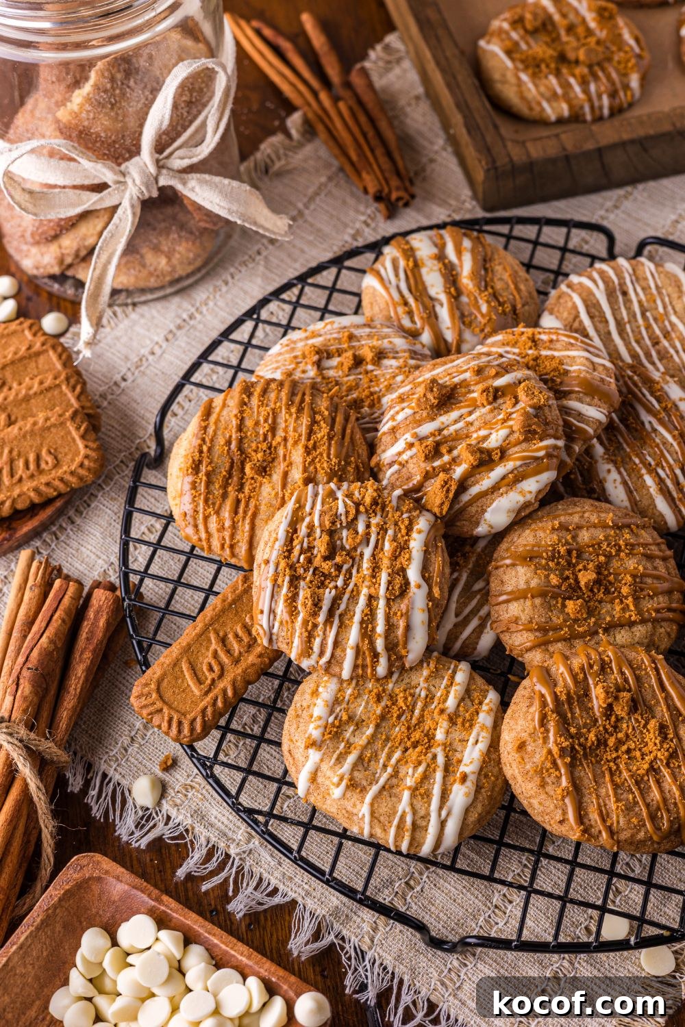 round cooling rack topped with Biscoff Snickerdoodle Cookies and a jar with ribbon and cookies 