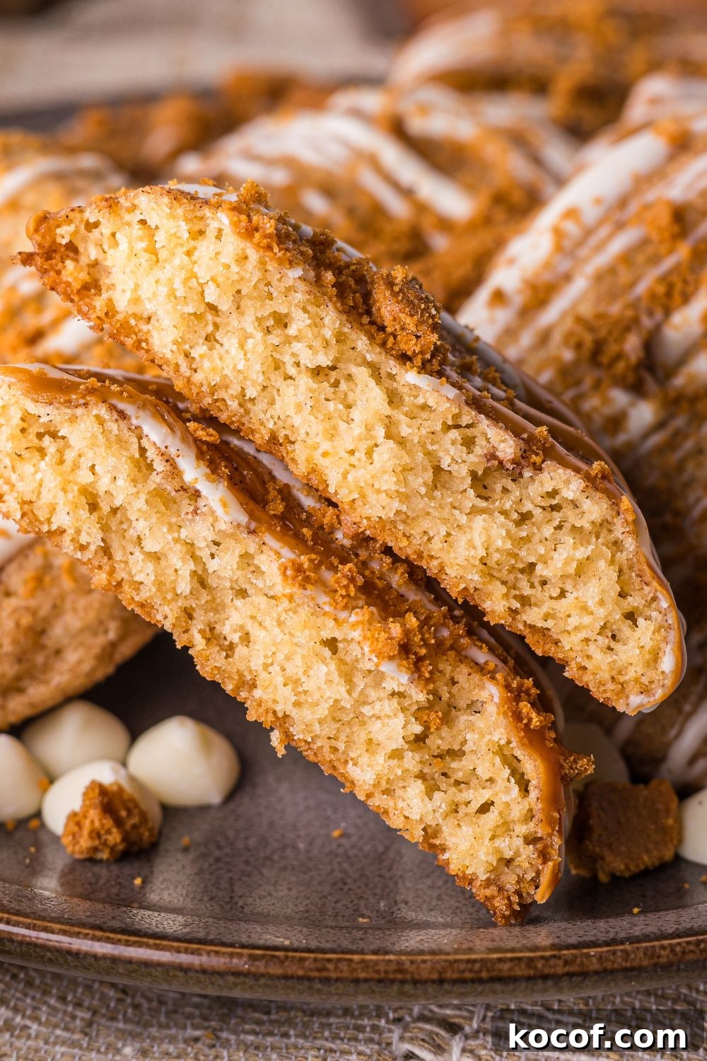 Biscoff Snickerdoodle Cookies on plate with one cookie cut in half 