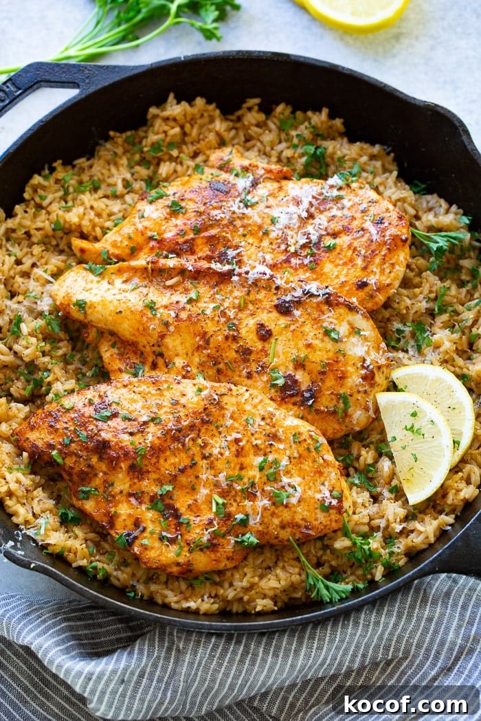 a cast iron pan full of simple garlic parmesan chicken with lemon rice