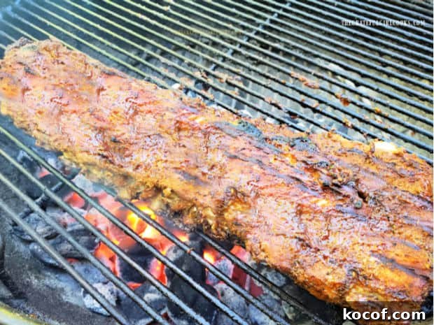 Baked Grilled Baby Back Ribs - The Grateful Girl Cooks! Baked grilled baby back ribs cooking over a hot BBQ grill.