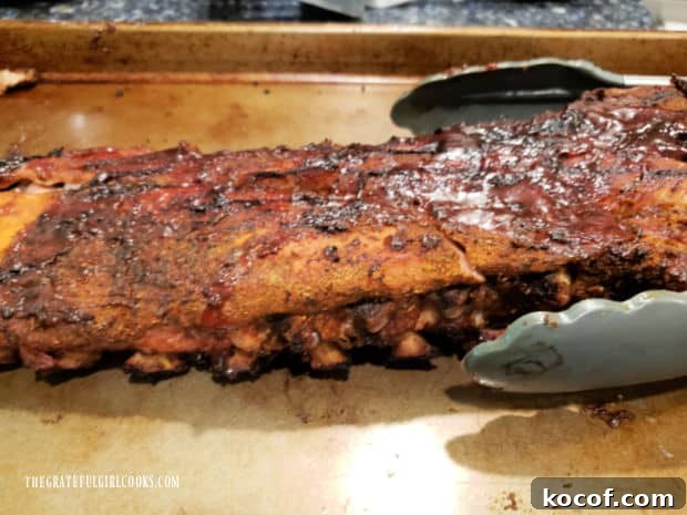 Baked Grilled Baby Back Ribs - The Grateful Girl Cooks! The baked grilled baby back ribs are done, and ready to be cut for serving.