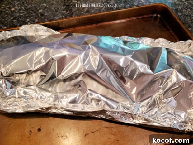 Baked Grilled Baby Back Ribs - The Grateful Girl Cooks! Seasoned ribs are sealed in foil packet on a baking sheet, then refrigerated.
