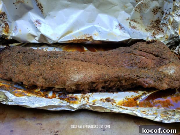 Baked Grilled Baby Back Ribs - The Grateful Girl Cooks! After baking for 2 and a half hours, the ribs are fully cooked.