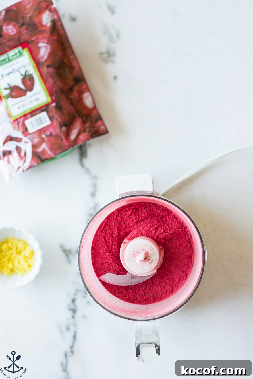Strawberry Lemon Sugar Cookies Recipe with Fresh Fruit Zest 7 Overhead photo of a mini food processor filled with crushed freeze-dried strawberries
