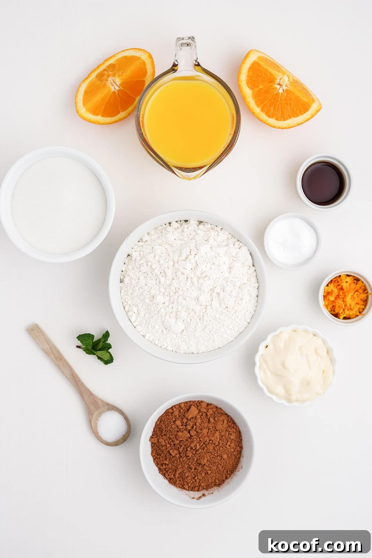 Ingredients to make chocolate orange bundt cake on the table.