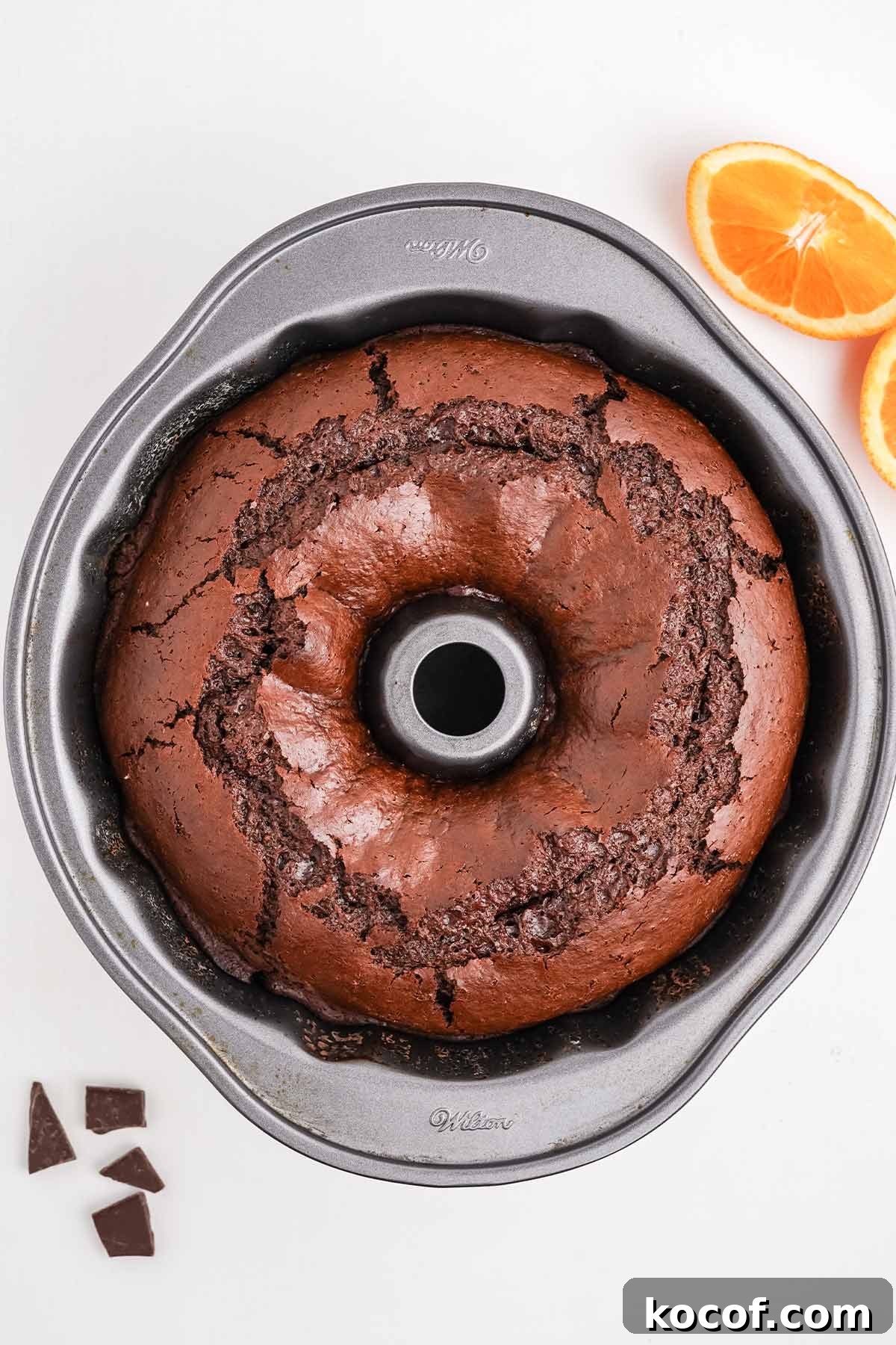 Chocolate orange bundt cake fresh from the oven in the pan.