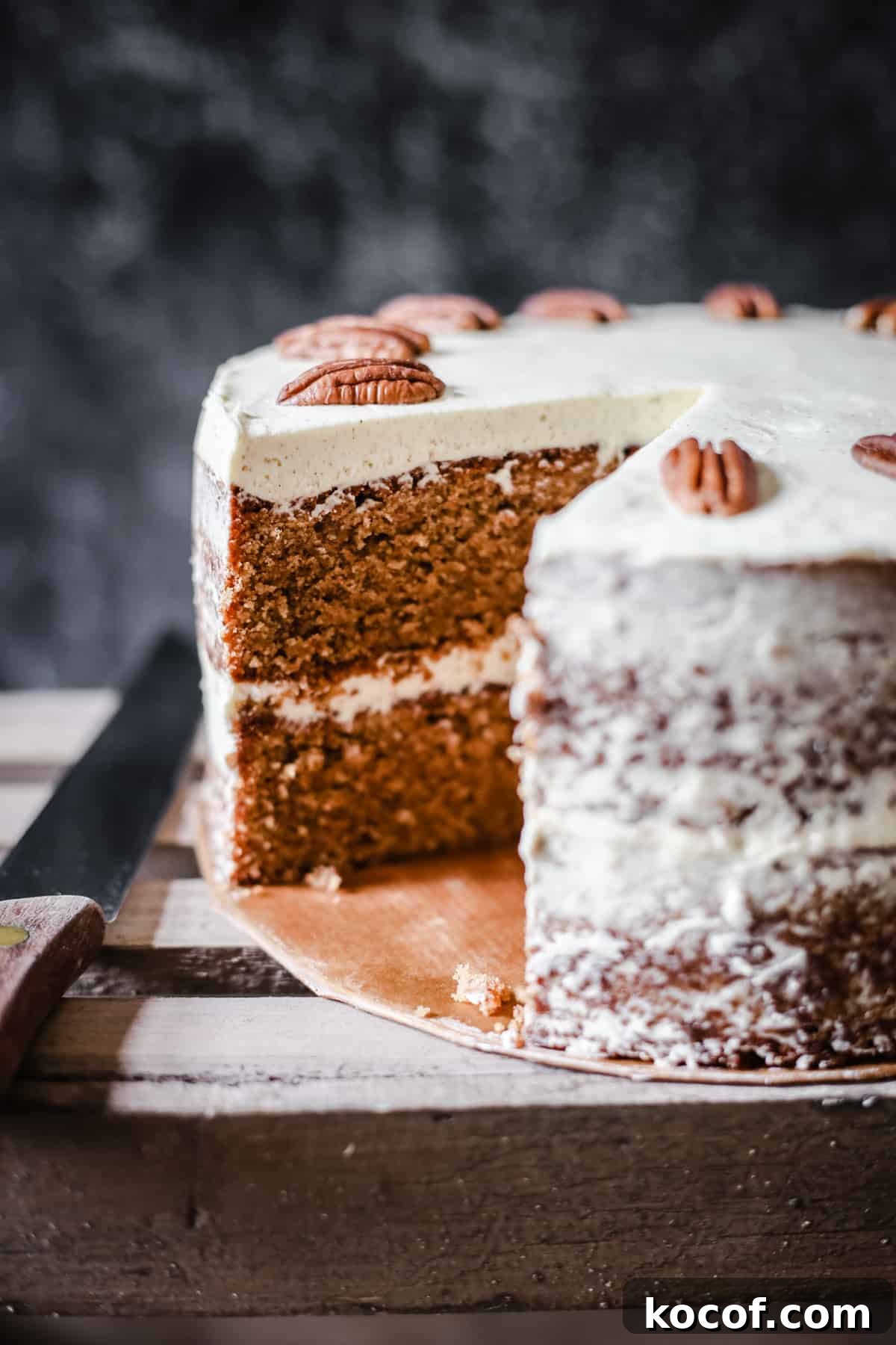 Gluten-Free Coffee Pecan Cake Recipe for Moist, Flavorful Slices 5 Pecan Butterscotch Latte Cake on a wooden box with a slice taken out