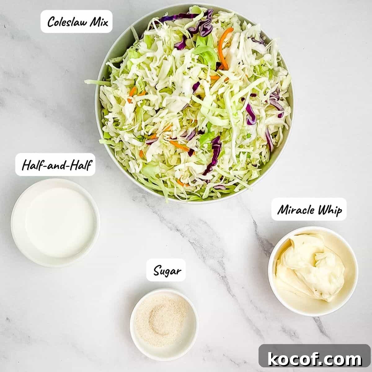 The ingredients for homemade Miracle Whip coleslaw on a white table.