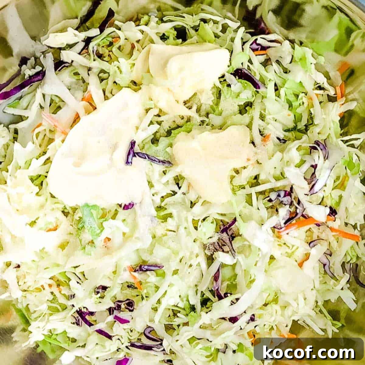 Miracle Whip, cream, and sugar added to the cabbage mix.