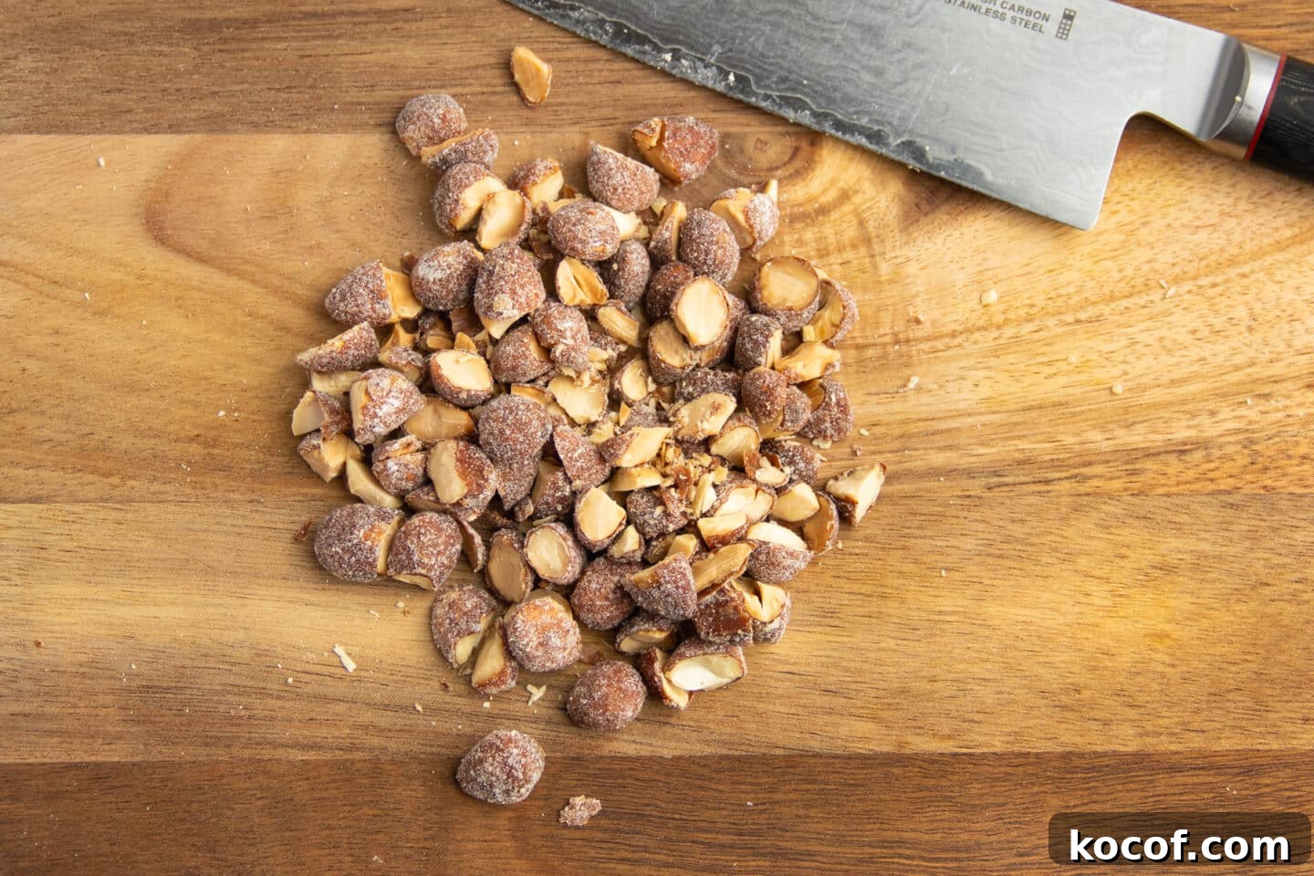 This is a picture of honey roasted almonds roughly chopped.