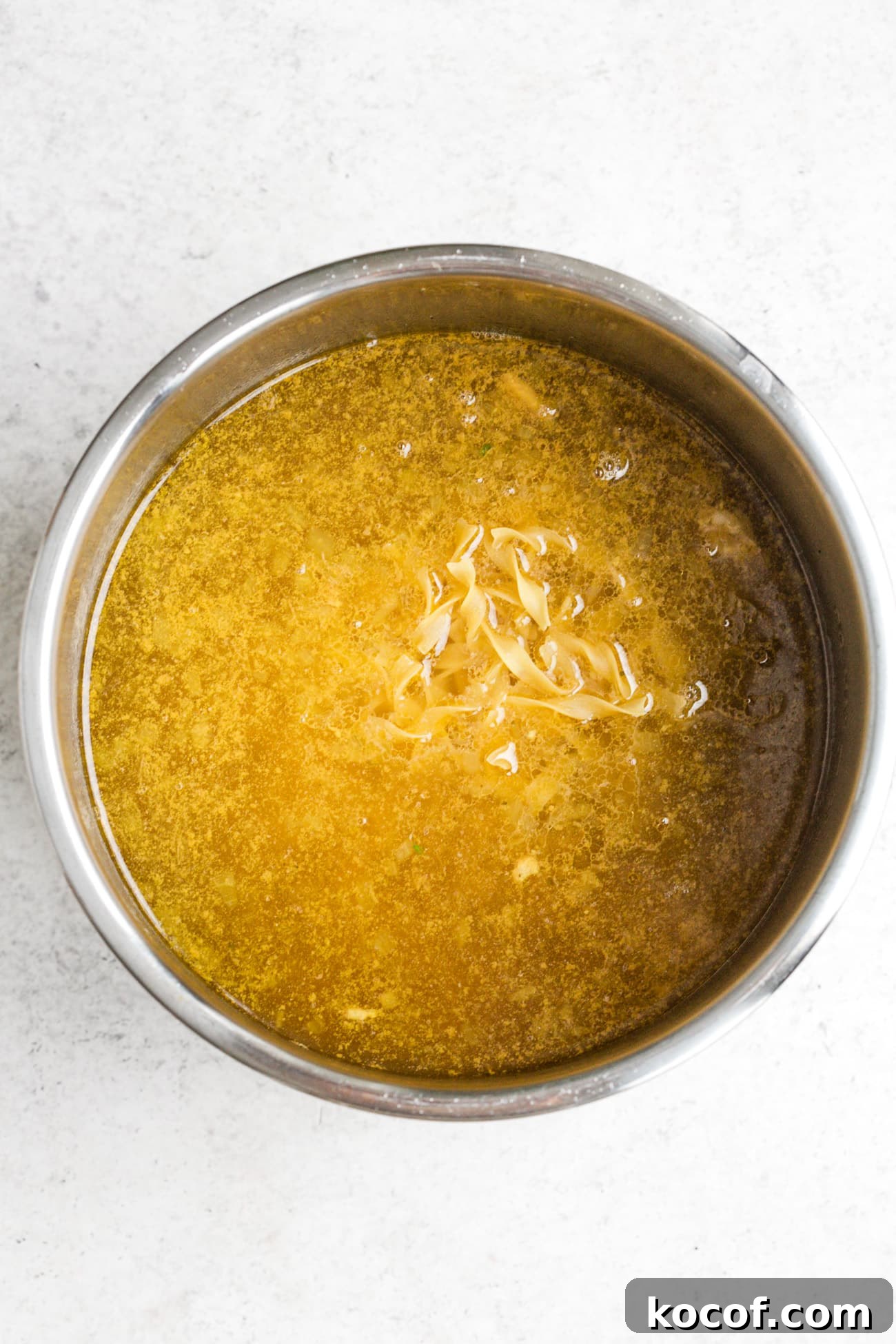 Creamy Instant Pot Chicken Noodle Soup Recipe 7 Egg noodles added to Instant Pot.