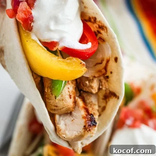 9 Juicy Grilled Chicken Recipes That Stay Moist Every Time 10 Juicy grilled chicken fajita wrap with colorful peppers, tomatoes, and creamy sauce. Perfect for a delicious Mexican-inspired meal.
