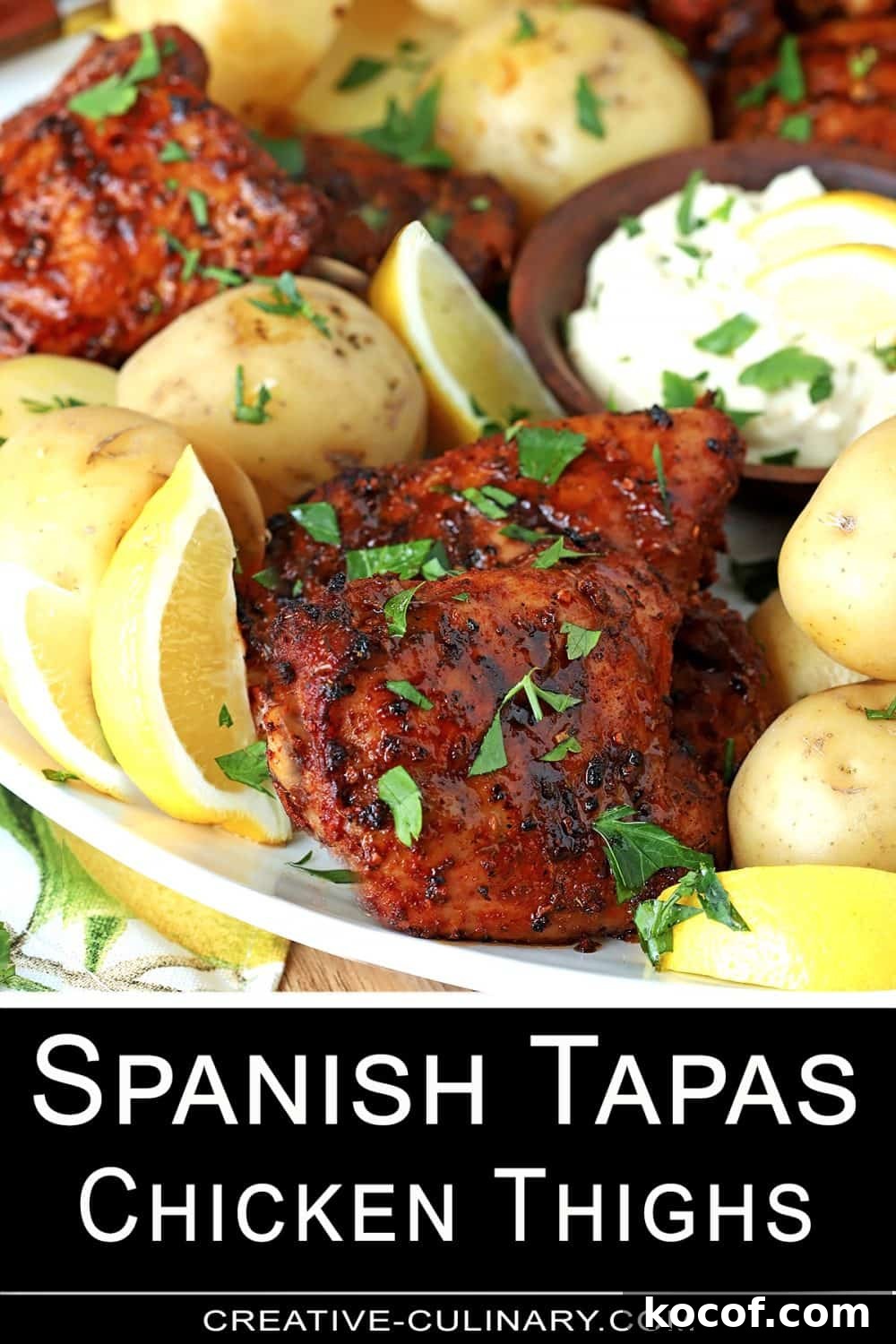 Spanish-Style Tapas Chicken Recipe for Flavorful Small Plates 5 Pin for Individual serving of Spanish Tapas Chicken Thighs served with potatoes and tomatoes.
