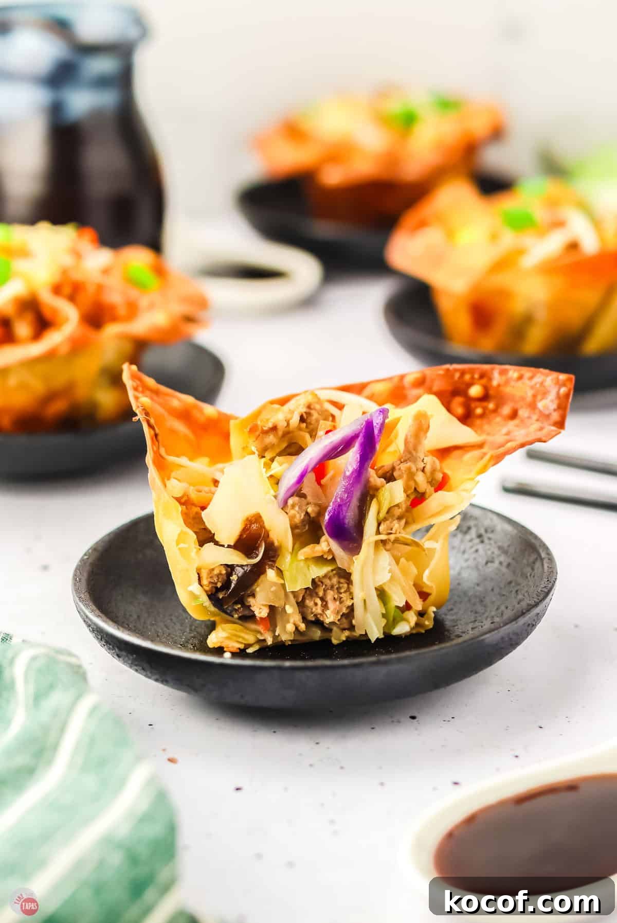 close up of wonton cup cut in half with cabbage mixture inside