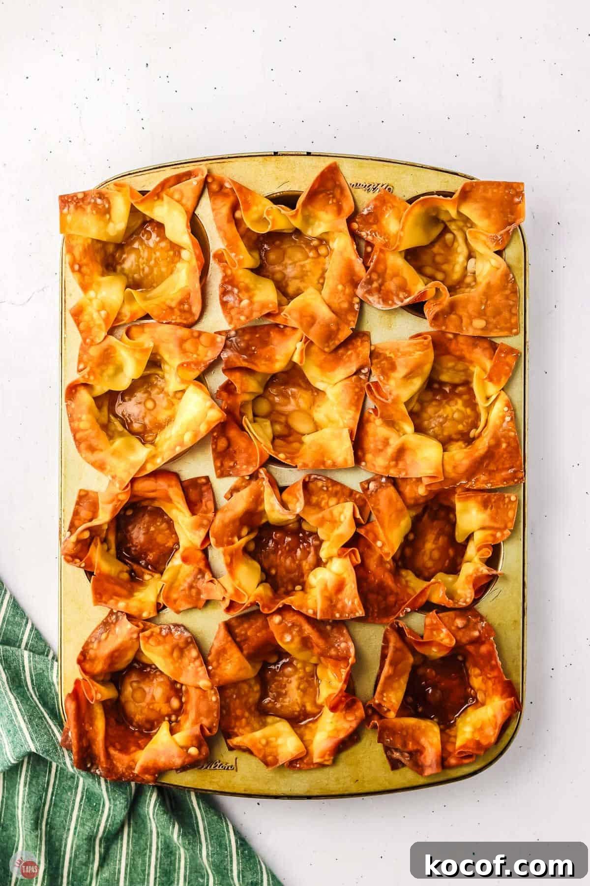 baked wonton cups in a muffin pan