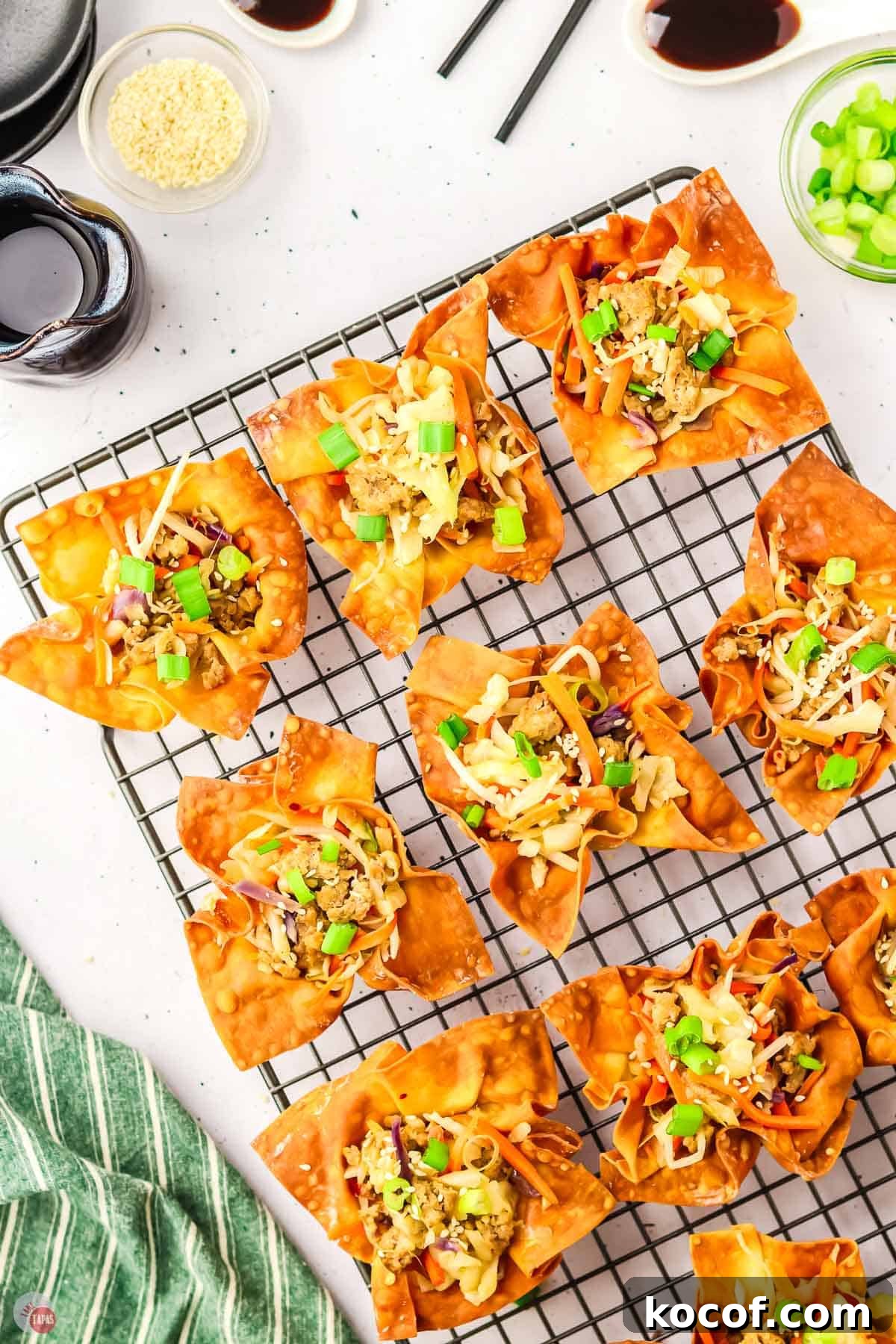 filled egg roll wonton cups on a wire cooling rack