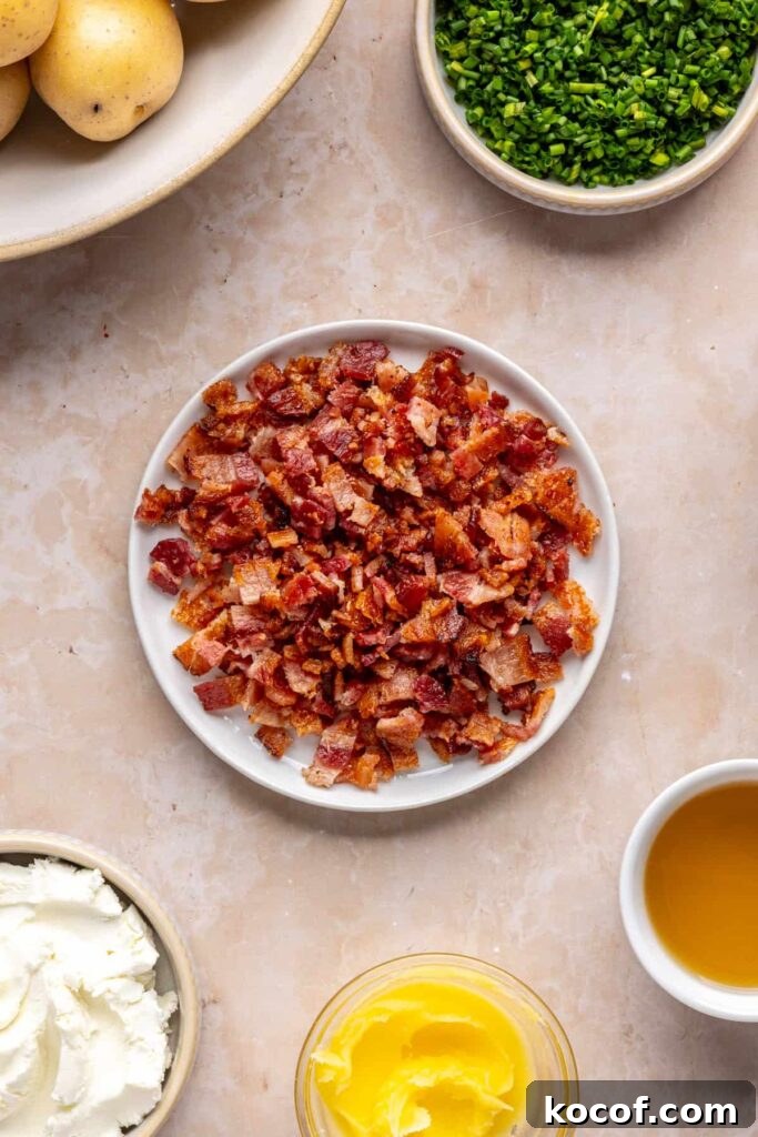 Chopped crispy bacon bits set aside on a plate, ready to be added to the filling