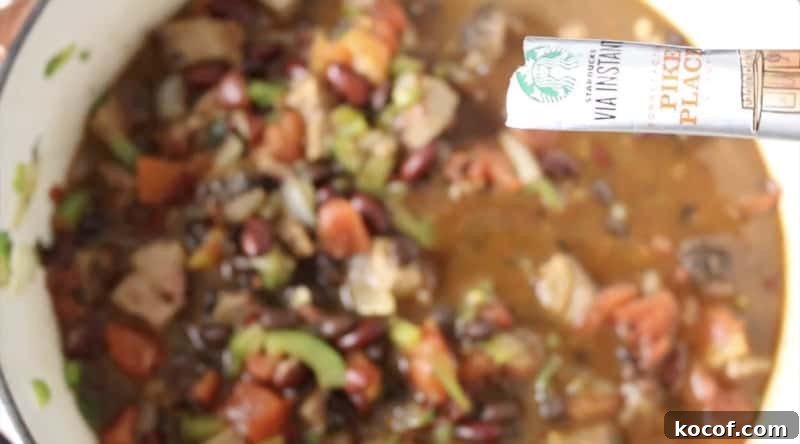 Smoked Brisket Chili Recipe: Bold, Smoky Chili with Beef Brisket 6 starbucks via instant coffee package being poured into smoked brisket chili
