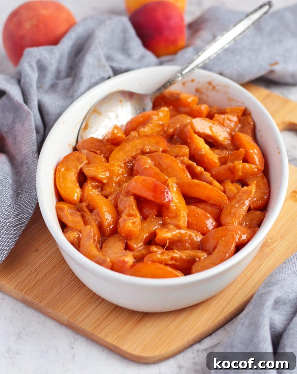 Apricot Crumble with Crunchy Oat Topping 4 Fresh apricots filling in a white ceramic dish