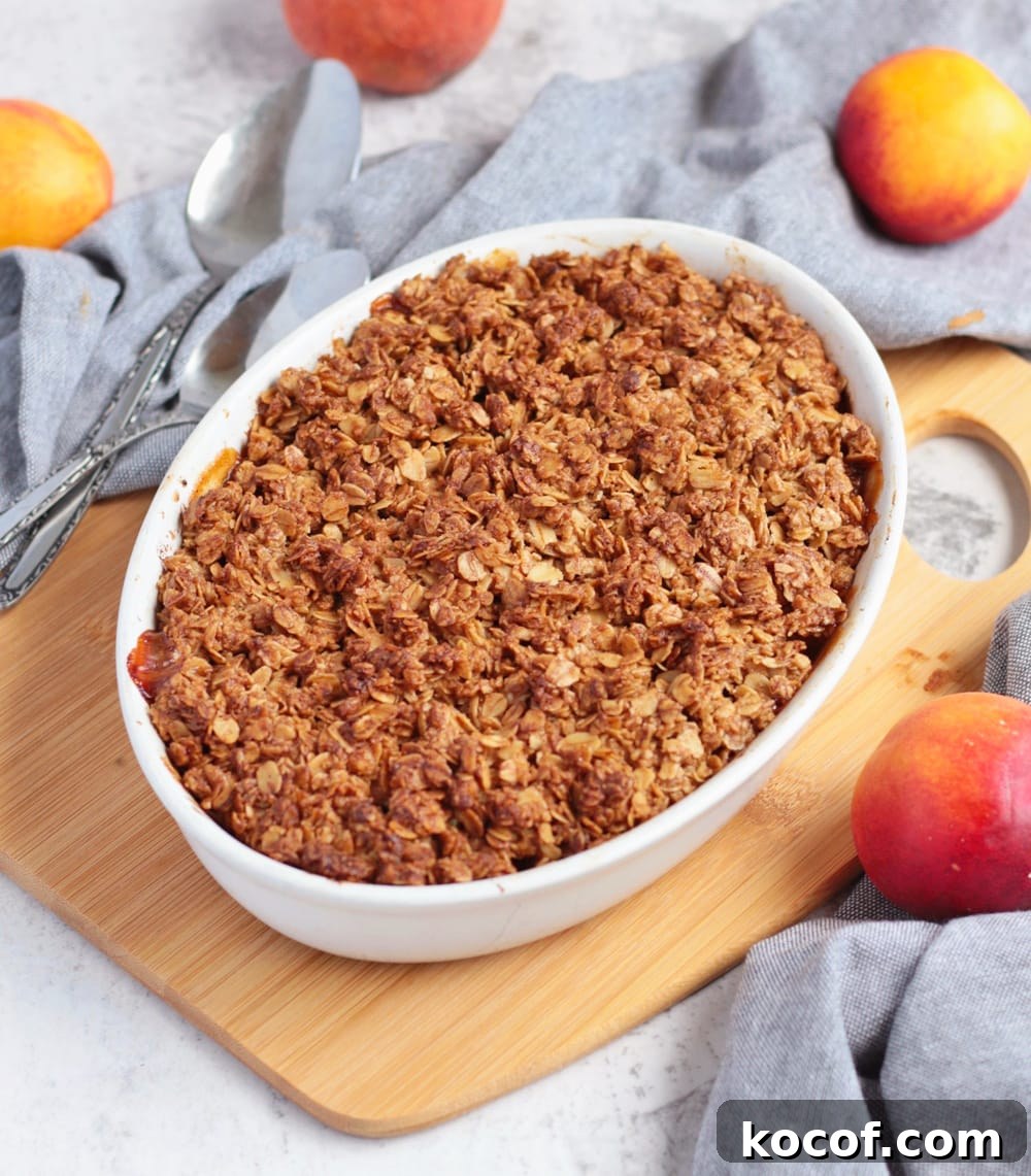 Apricot Crumble with Crunchy Oat Topping 6 Baked crumble over a wooden board next to a grey napkin