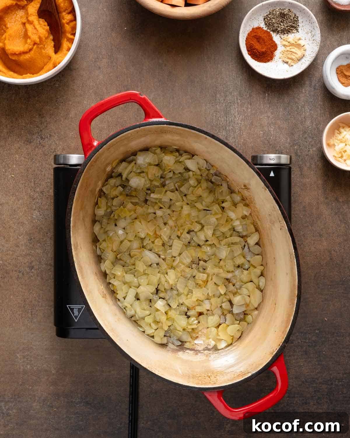 onions cooked in soup pot on burner.