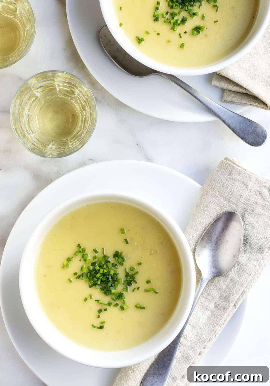 Creamy Potato and Leek Soup Recipe — Comforting Weeknight Meal 2 Potato Leek Soup served in white bowls