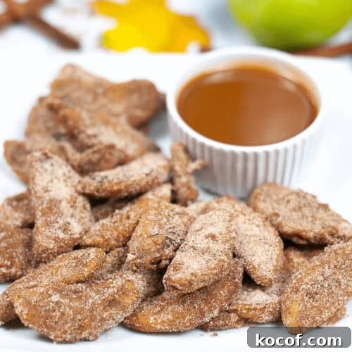 Crispy Pumpkin Spice Air‑Fried Apple Slices for Fall Snacks 7 A tray of the dessert with caramel sauce.