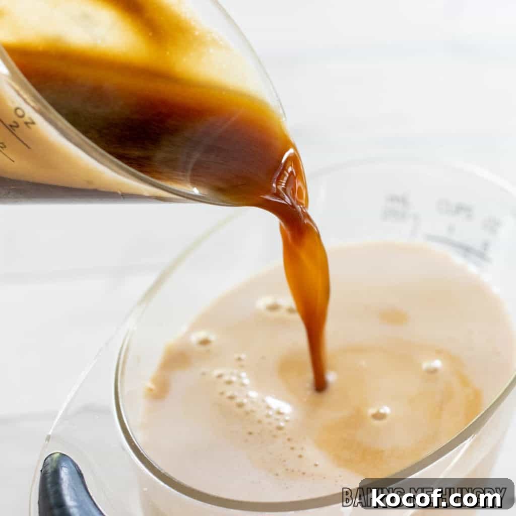 espresso being added to milk